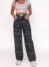Pantalón Jean Ancho Oscuro Manchado Oversize — puesto